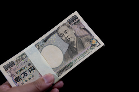 A photograph of showing off a bundle of Japanese old billsの写真素材