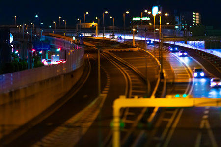 A night photography of miniature traffic jam on the city highway in Saitamaの写真素材