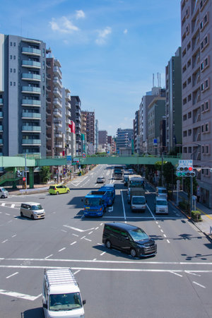 A cityscape of traffic jam at the downtown crossing in Tokyo wide shotの写真素材
