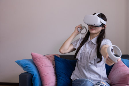 A Japanese woman wearing VR glass in the roomの写真素材