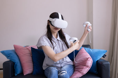 A woman playing with VR glass in the room