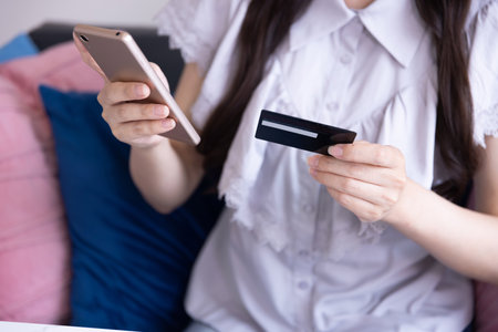 Japanese woman online shopping by card and smartphone in the