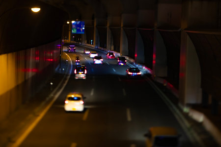 A night photography of miniature traffic jam under the city overpass in Tokyo