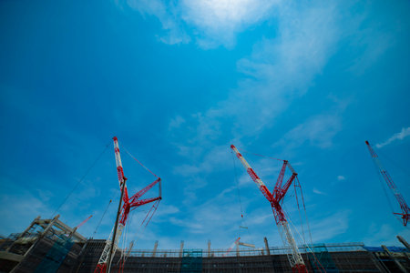 A cityscape of the crane at the under construction in Tokyo low angle viewの写真素材
