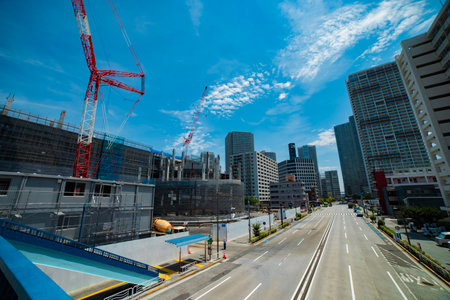 A cityscape of the crane at the under construction in Tokyo wide shot