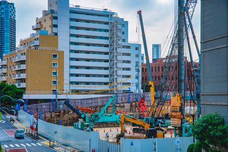 A cityscape of moving crane at the under construction in Tokyoの写真素材