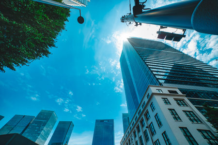 A cityscape of cloud reflecting the office building at the city low angle viewの写真素材