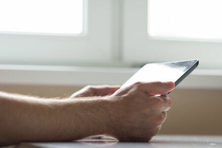 Closeup of man with tabletの写真素材