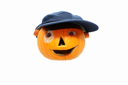 pumpkin decorated for a healthy diet. Eyes-cranberries, nose-carrots, mouth-garlic, carrot ears.Halloweenの写真素材