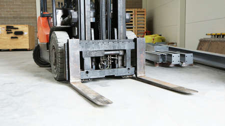 Car -Old forklift, forklift, stacker truck, warehouse forklift. Old car under repair in the garage.