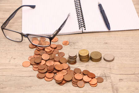 Pre-installation of money saving concept. Money and a financial income chart are on the desk in the...