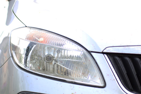 Front of the car with headlights close-up. Front bumper and headlight close-up.の写真素材