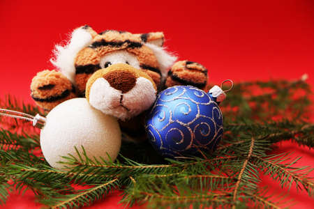 Christmas festive decor with a tiger on a red background.の写真素材