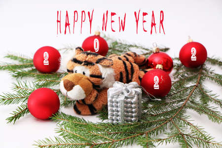Tiger as a symbol of 2022, Christmas and New Year. Festive decorations for the new year and christmas. Christmas festive decor with a tiger on a white background.の写真素材