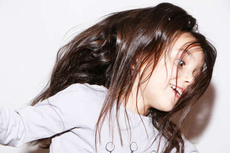 Little girl model is actively involved in sports. The girl shows clothes for the rest.の写真素材