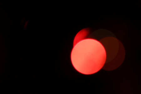 New Year decorations on a blurred black background. New Year's garland burns on a blurred black background.の写真素材