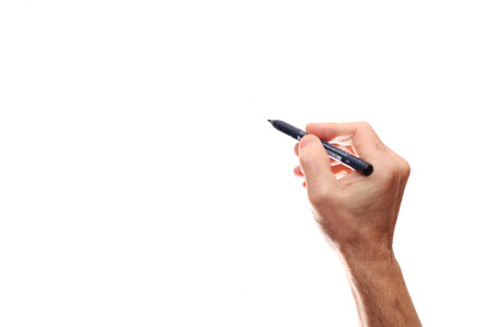 Pen in hand of a man on a white background. A man with a pen in his hand signs a document.の写真素材