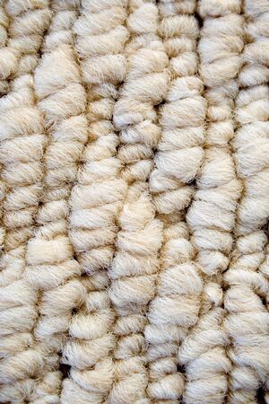Texture of woolen carpet, made from natural wool.