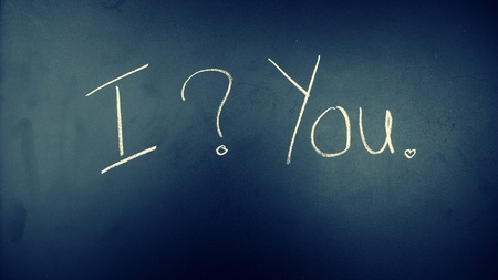 'I ? you' sentence draw by white chalk on shiny blackboard. Unhappiness valentine with question, vintage backgroundの写真素材