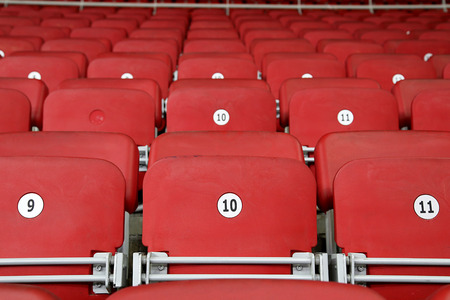 Empty Red Grandstand Stadium Seatsの写真素材