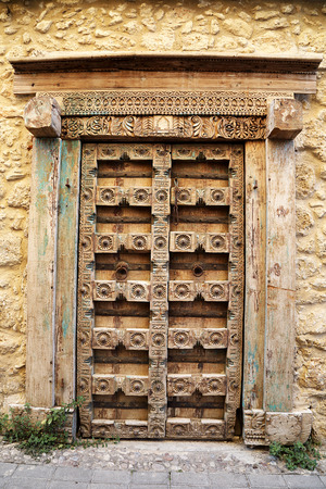 Old Traditional Weathered and Carved Doorの写真素材
