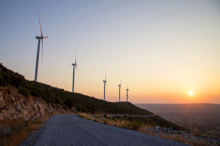 Beautiful Sunset with Wind Turbines Silhouettesの写真素材