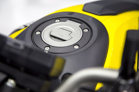 Close up shot of a yellow motorcycle fuel tank cover cap