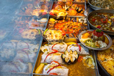 Traditional colorful Turkish food near showcase in a restaurantの写真素材