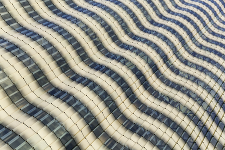 Wide angle perspective view of a modern high rise building glass window textures backgroundの写真素材