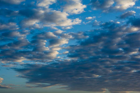 White clouds in a blue skyの写真素材