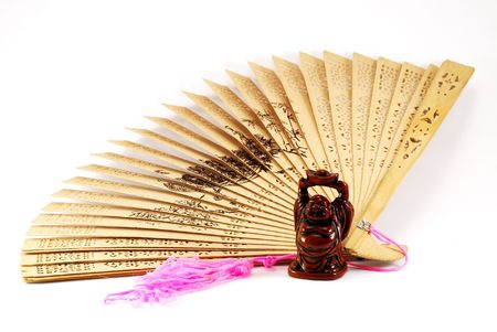 Figurine of the Buddha against a fanの写真素材