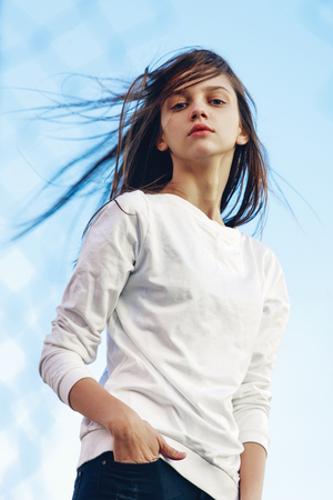 portrait of a beautiful girl in a blouseの写真素材
