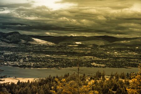 dramatic photo of a landscape with lake view and mountains の写真素材