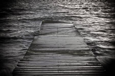 black and white creative photo of a footbridge の写真素材