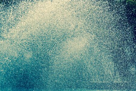 Splashing fountain in city parkの写真素材