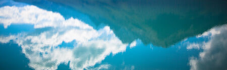 mountains clouds and sky; water reflectionの写真素材