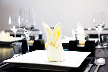 Served table with dishes and glassesの写真素材