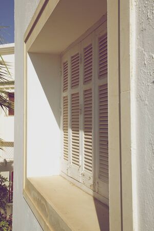 Historic wood shutter. View from aside