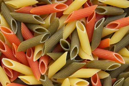Raw three-coloured Italian pasta. Backgroundの写真素材