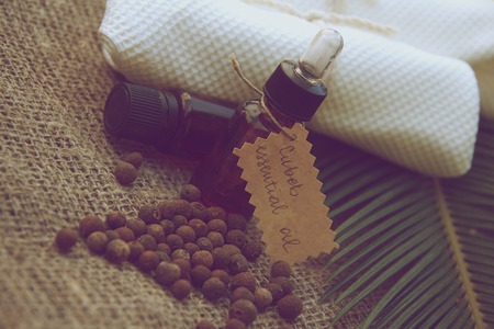 A bottle of cubeb essential oil on the sackcloth. Vintageの写真素材