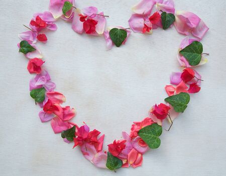 Flower composition in the form of a heart - background. Free space for a text.の写真素材