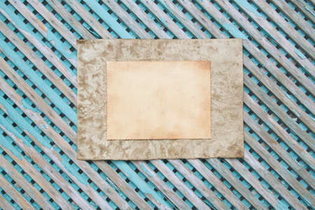 Old pieces of paper on an old green wooden surface. Free space for a text.の写真素材