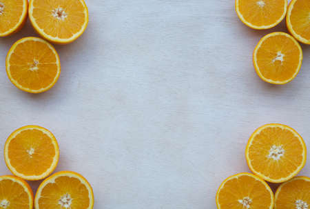 Oranges - horizontal section. Background. Free space for a textの写真素材