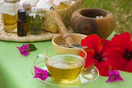 Afternoon tea spa day. A cup of tisane on a spa tableの写真素材