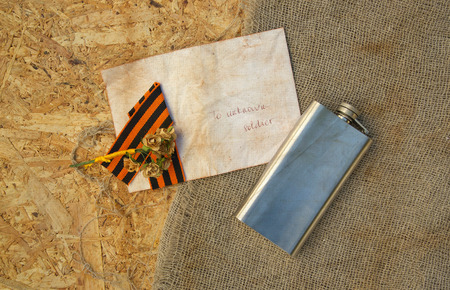 Saint George ribbonhip flaskpaper rosesletter to unknown soldier and free space for a text. Backgroundの写真素材