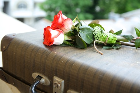 A bunch of pink roses on an old vintage caseの写真素材