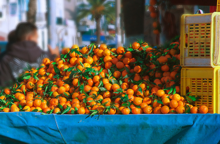 Fresh picked up tangerine fruits at a Sunday marketの写真素材