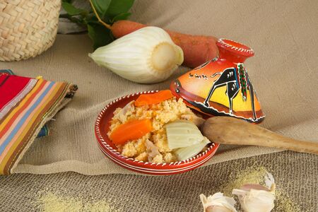 Traditional berber dish of semolina - couscous in the tagine.の写真素材