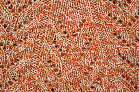 Orange brown white knitted surface - background