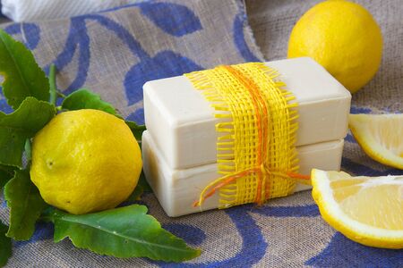 Lemon soap. Fresh lemon fruit in the backgroundの写真素材